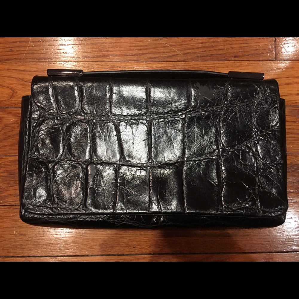 All real leather bag. Small mark on the front.